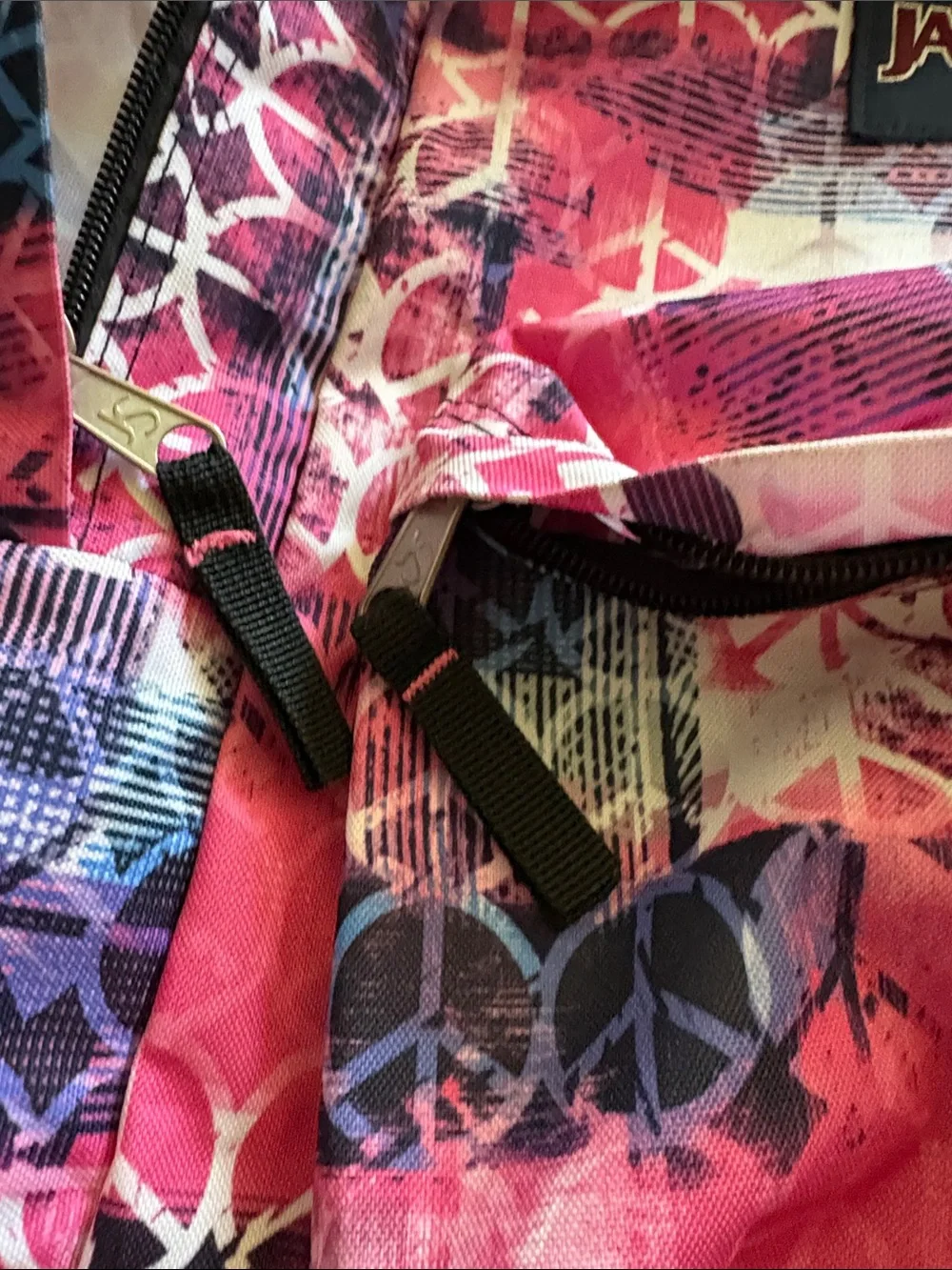 Jansport Pink Peace Sign Pattern Backpack with Purple & Blue Accents